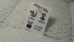 Johnny the Monkey performing card tricks on a bicycle for magical entertainment.