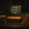 Close-up of "From Idea to Stage" book about Smayfer's magic journey.