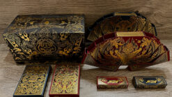 High-quality Asura Collector Box Set playing cards with intricate gold and red designs. Perfect for.