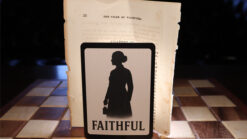 Silhouette of a woman holding a card with 