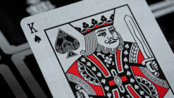 Close-up of Ace Fulton casino playing cards with intricate design and royal imagery.